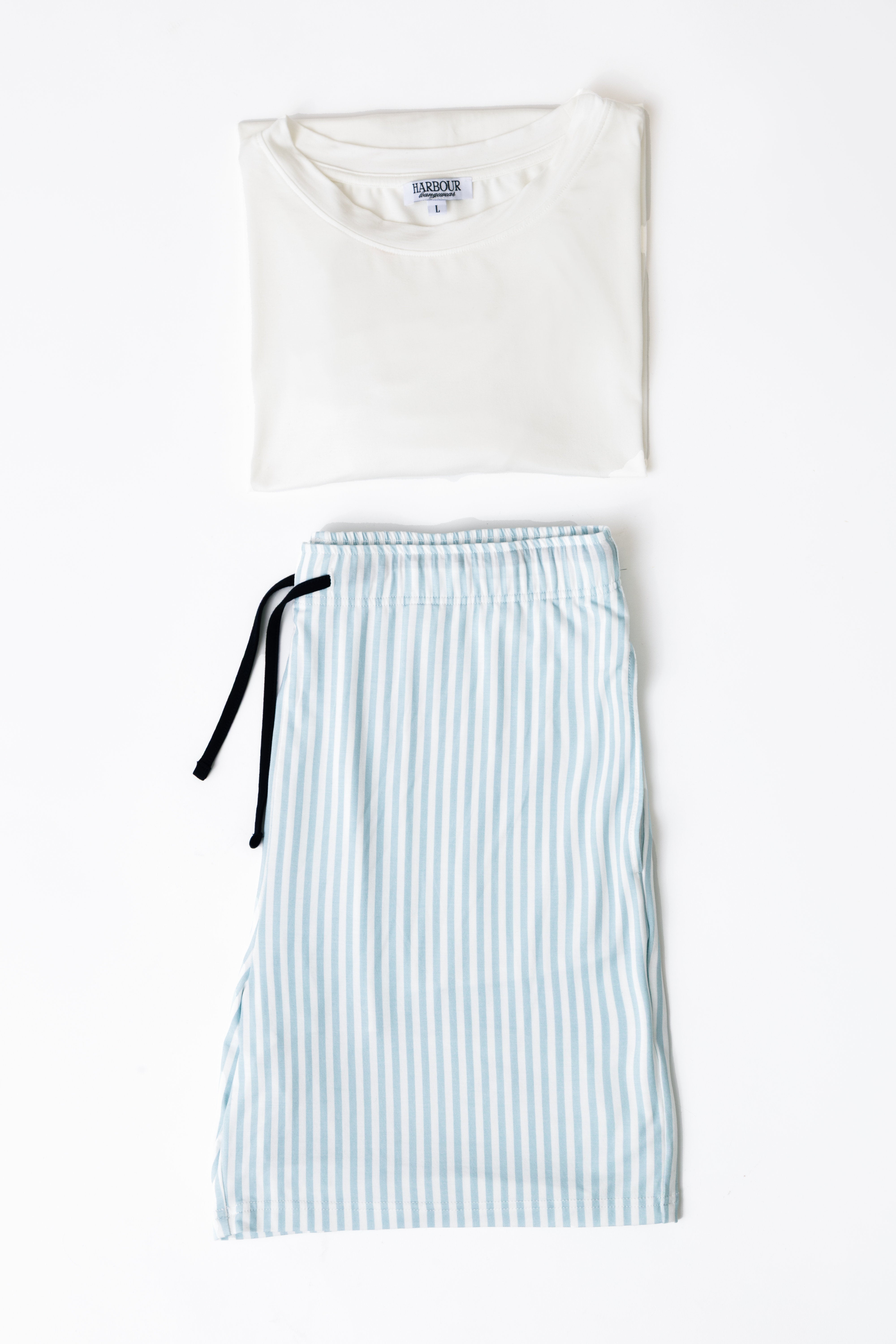 Harbour white modal T-shirt folded beside blue striped pajama shorts – soft breathable nightwear set